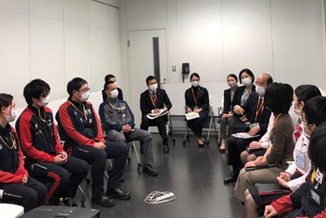 Round table meeting between employees and management