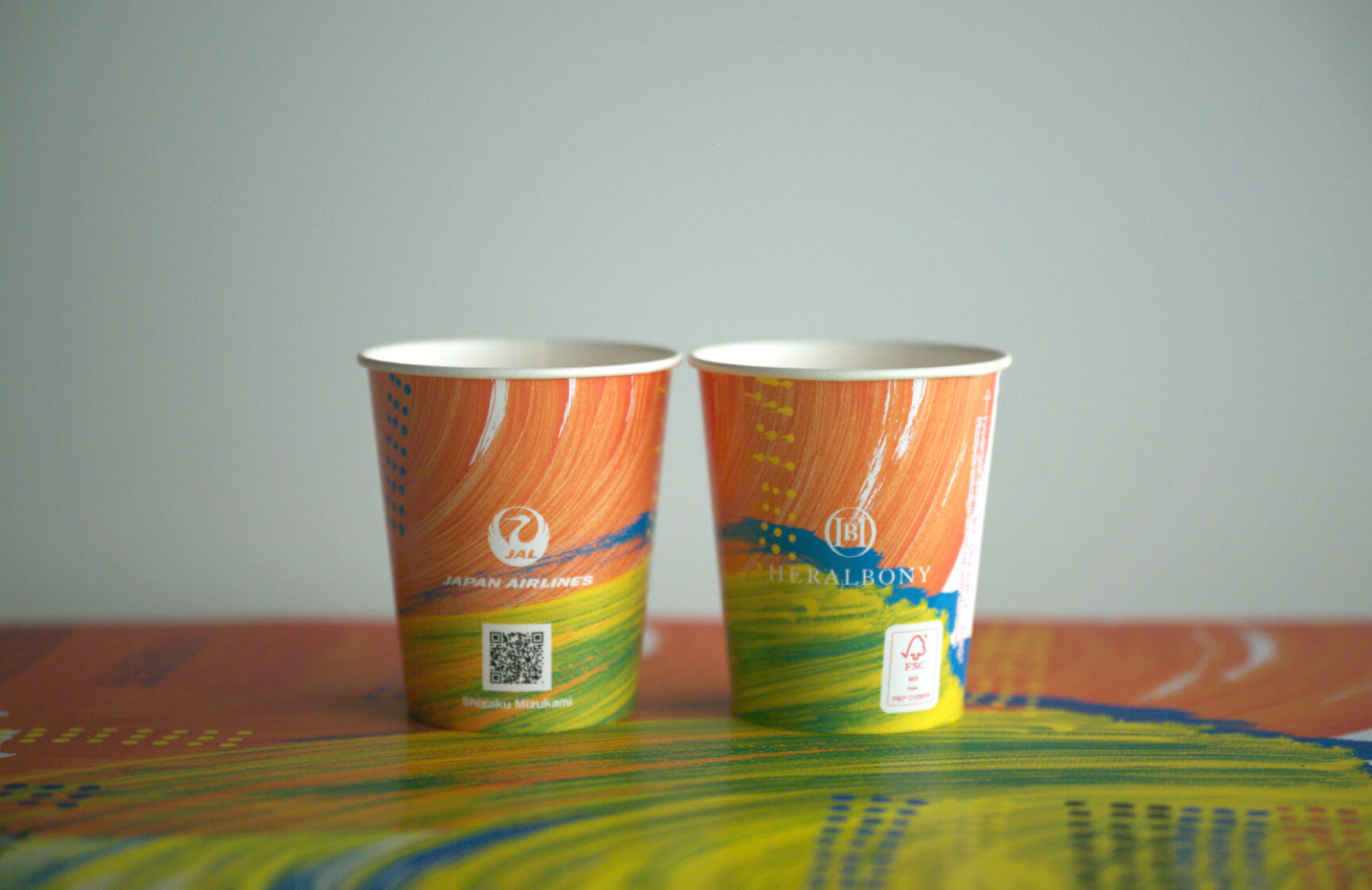 Paper cups featuring artwork that won the  “JAL Prize” introduced on all flights