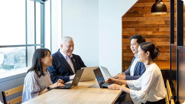 A harmonious meeting scene with diverse staff members.